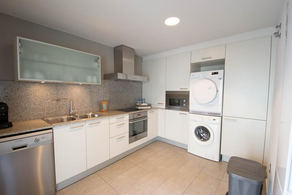 Kitchen or kitchenette, dishwasher, oven, stove, washing machine, dryer