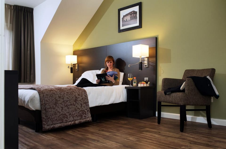 Bed, People, Seating area, Bedroom