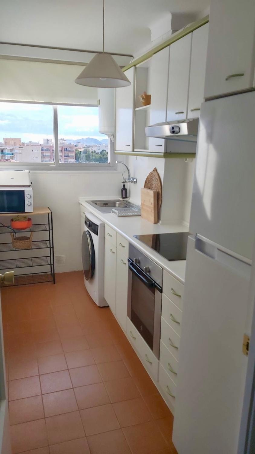 Kitchen or kitchenette, oven, stove, toaster, washing machine