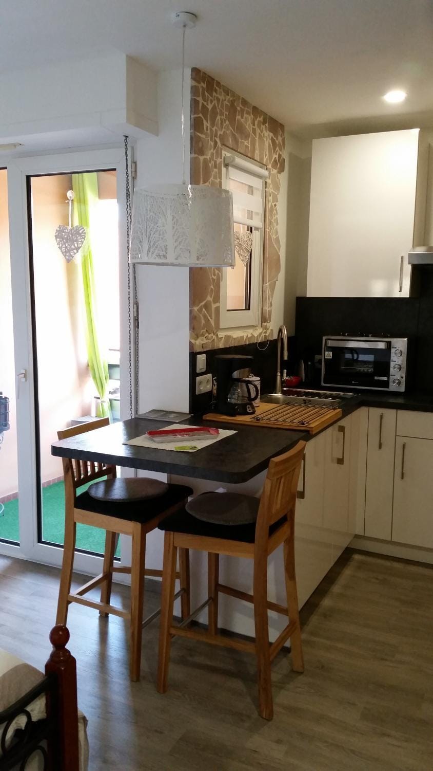 Dining area, microwave, stove, toaster