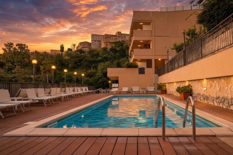 Property building, Patio, View (from property/room), Pool view, Sunset, sunbed
