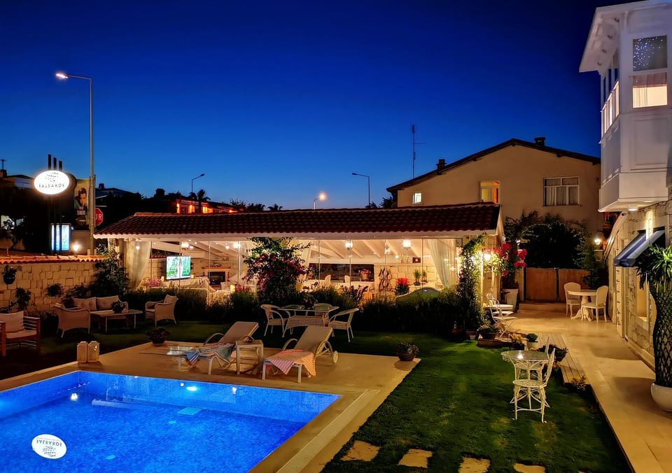 Property building, Patio, Night, Pool view, Swimming pool, sunbed
