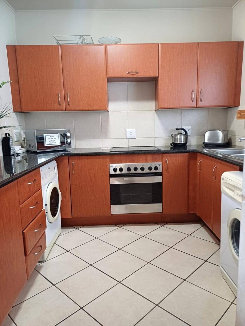 Kitchen or kitchenette, washing machine