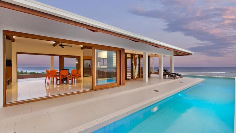 Property building, Patio, Day, Natural landscape, Pool view, Sea view, Swimming pool
