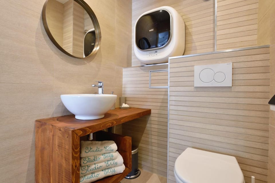 Shower, Toilet, Property logo or sign, Bathroom, Decorative detail, Decorative detail