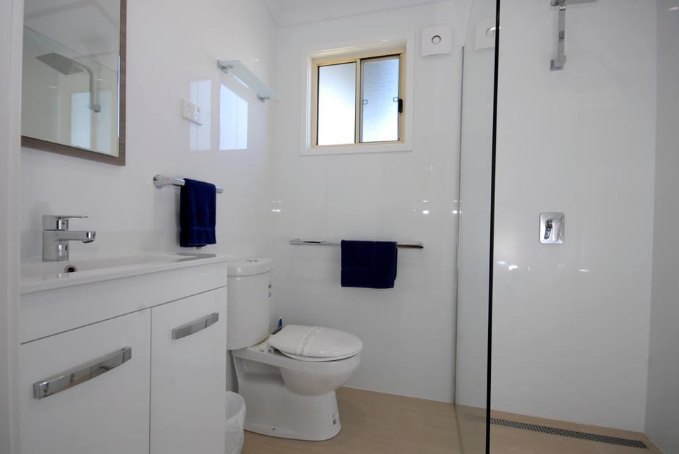 Shower, Toilet, Bathroom, hair dryier, towels, air conditioner