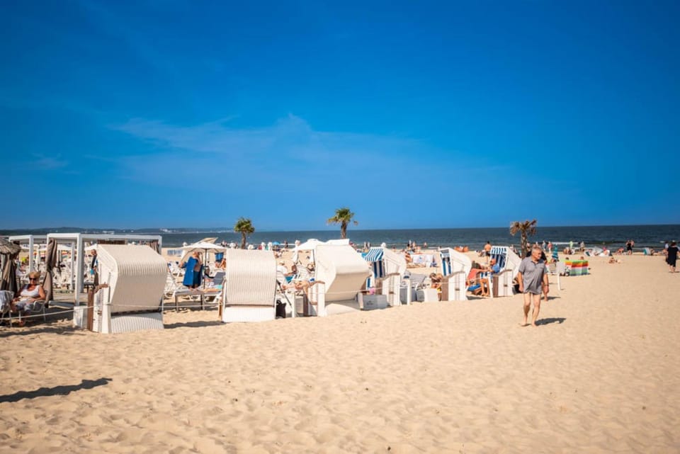 Nearby landmark, People, Natural landscape, Beach, sunbed