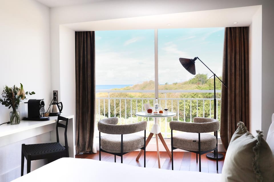 Bed, Natural landscape, View (from property/room), Living room, Bedroom, Sea view