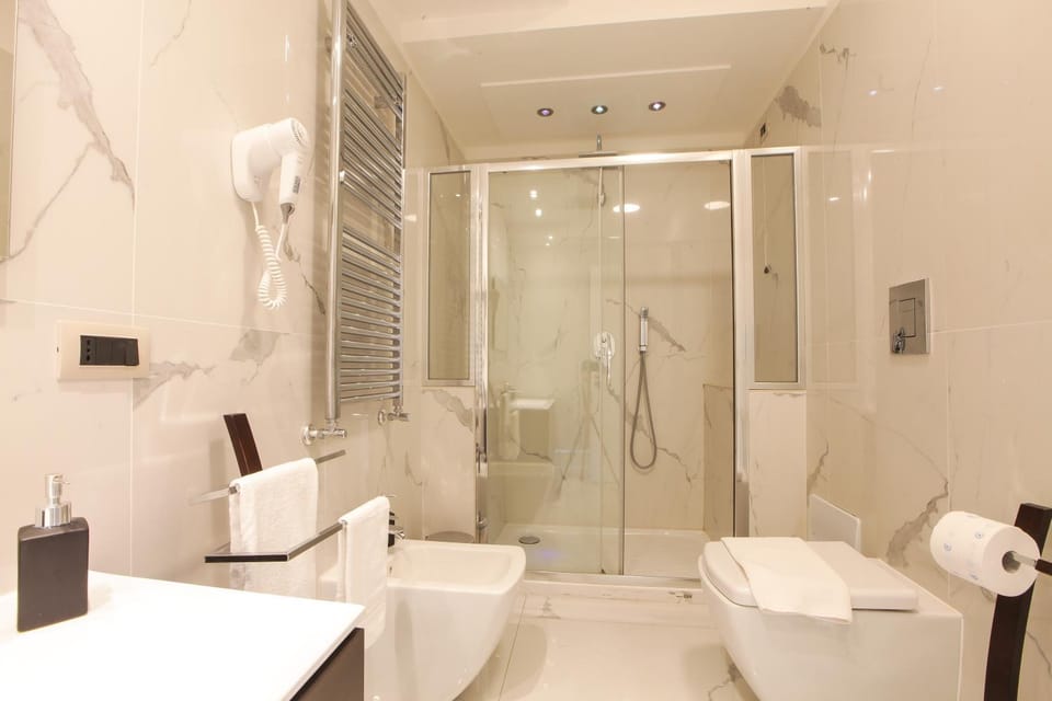 Shower, Toilet, Bathroom, bidet, hair dryier, towels