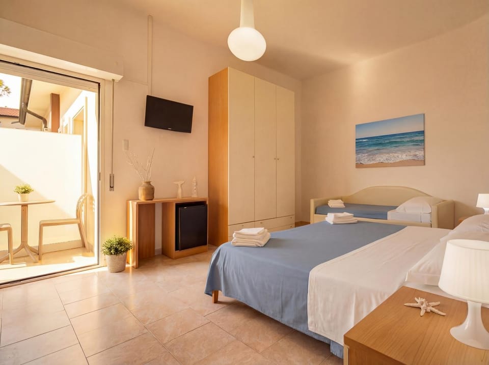 Bed, towels, wardrobe