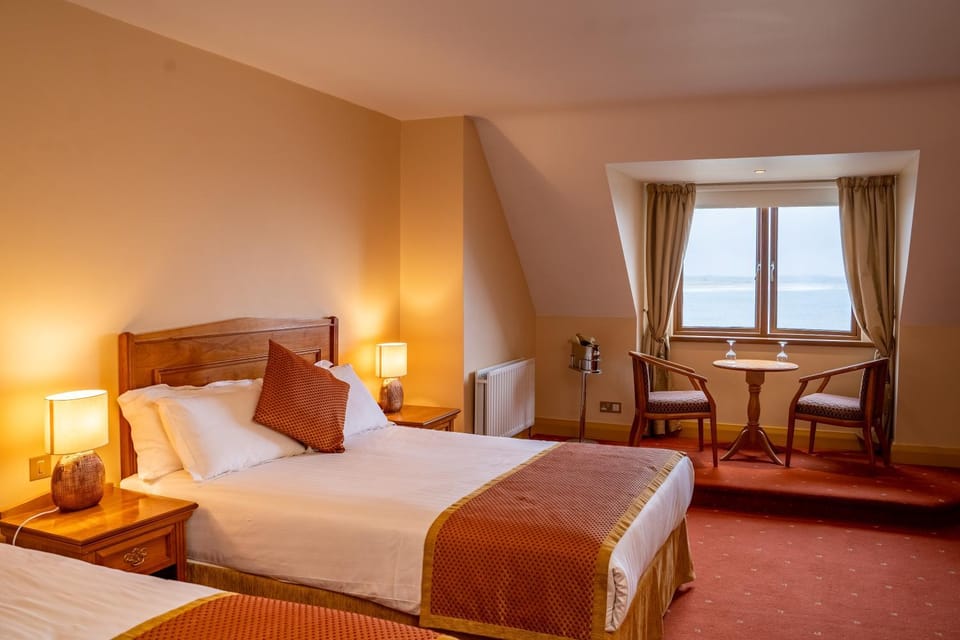 Bed, Seating area, Bedroom, Sea view