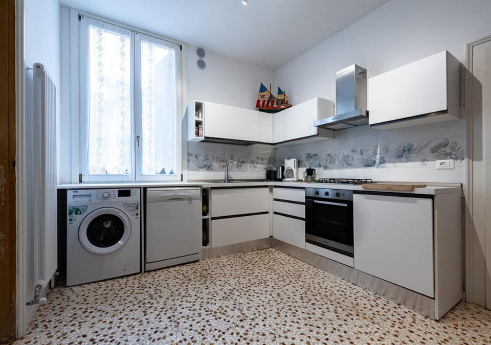 Kitchen or kitchenette, dishwasher, oven, stove, washing machine