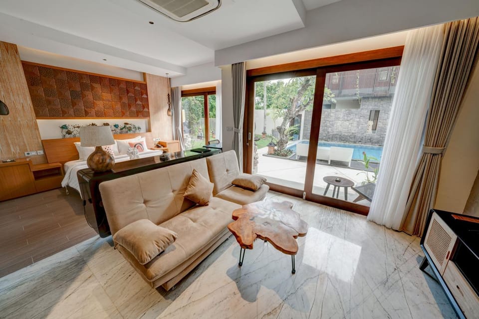 Living room, Seating area, Pool view