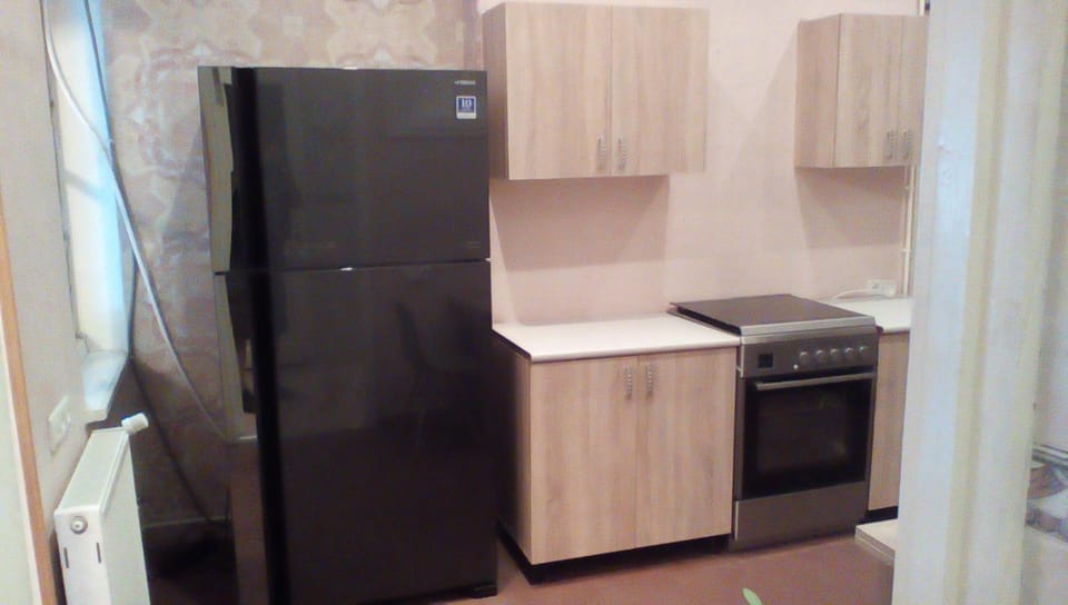 Kitchen or kitchenette, oven, stove, toaster, air conditioner