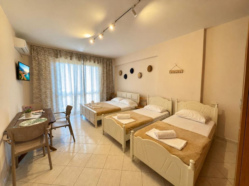 Bed, TV and multimedia, Living room, Photo of the whole room, Seating area, Bedroom, towels, air conditioner