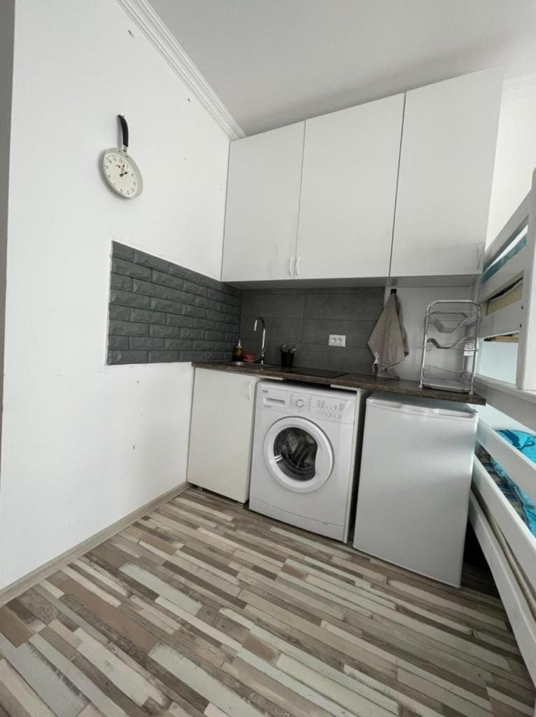 Kitchen or kitchenette, washing machine