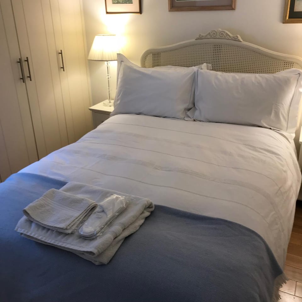 Bed, towels, wardrobe