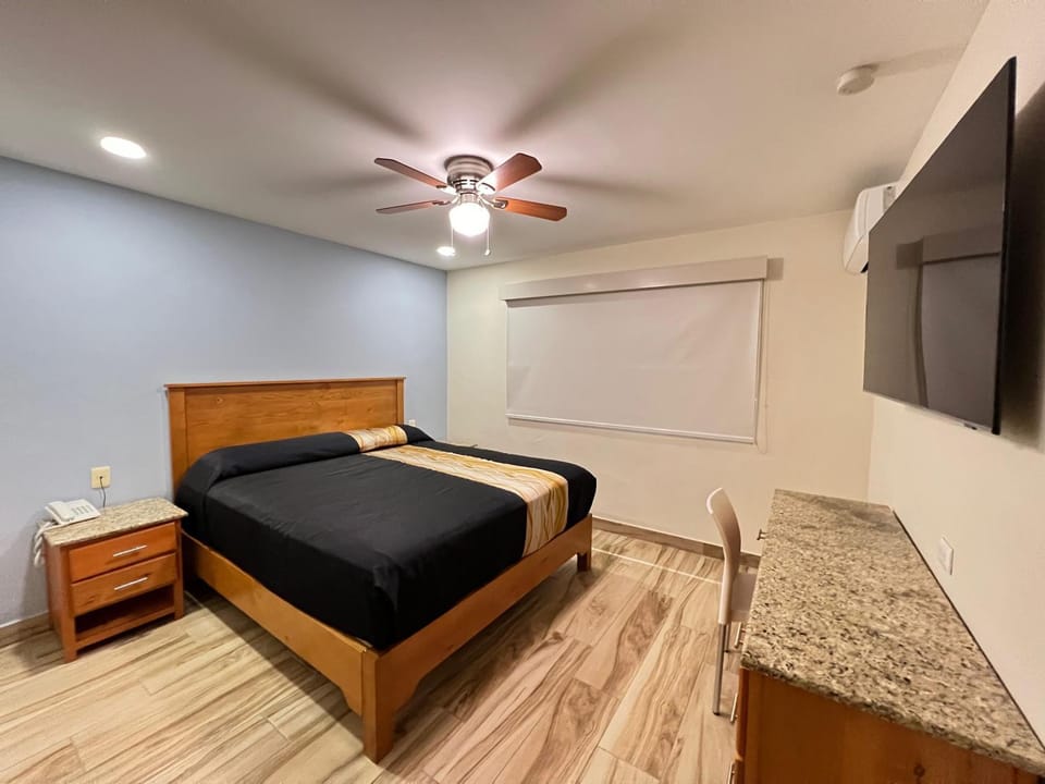 Property building, TV and multimedia, Bedroom, fireplace