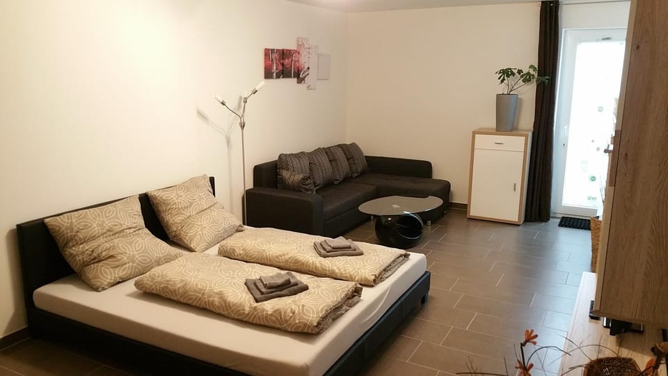 Toilet, Living room, Seating area, Dining area, Bedroom