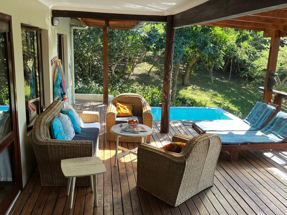 Patio, Natural landscape, Garden, Seating area, Pool view, Swimming pool, sunbed
