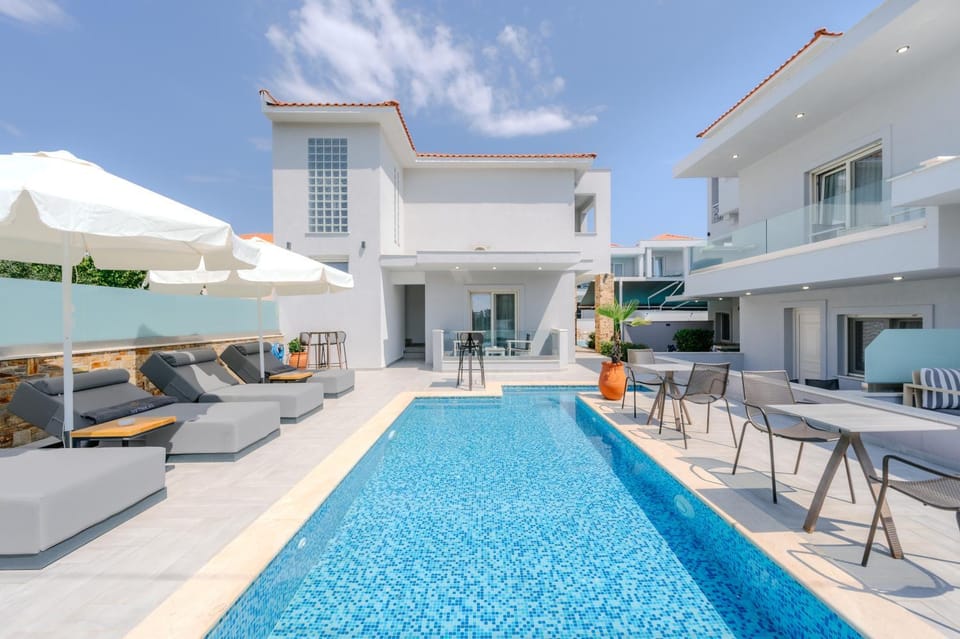 Property building, Patio, Day, Living room, Seating area, Pool view, Swimming pool, sunbed