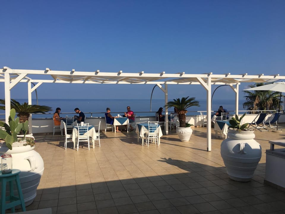 Restaurant/places to eat, People, Natural landscape, View (from property/room), Balcony/Terrace, Sea view
