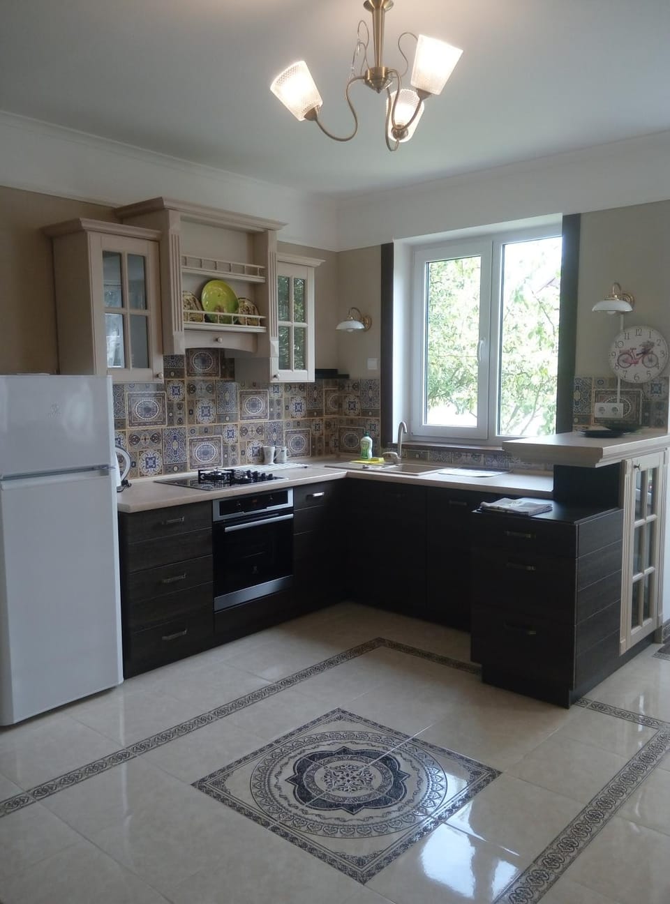 Kitchen or kitchenette, dishwasher, oven, stove