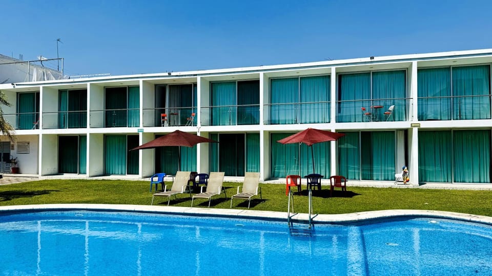 Property building, Patio, Day, Pool view, Swimming pool