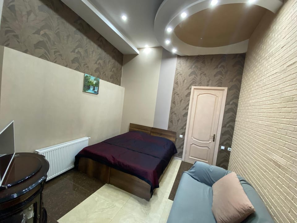 Bed, Living room, Seating area, Bedroom, hair dresser, air conditioner