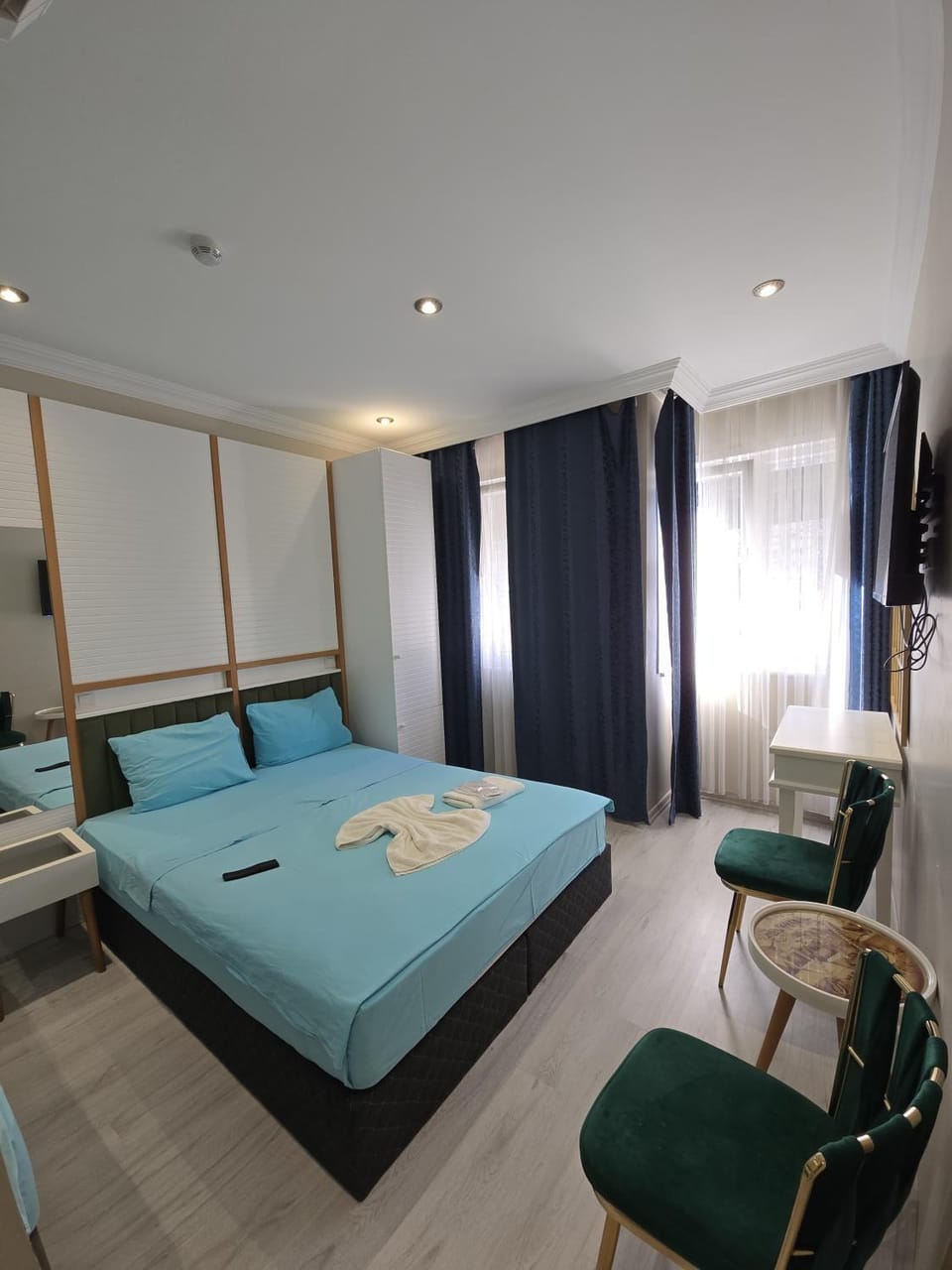 Bed, TV and multimedia, Living room, Seating area, Bedroom, towels, wardrobe