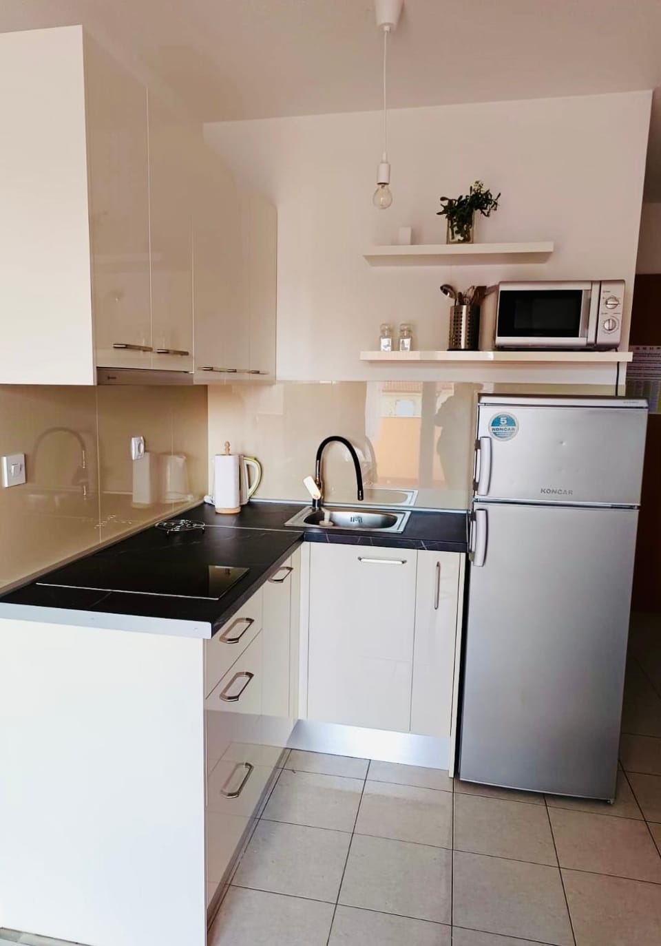 Kitchen or kitchenette, dishwasher, microwave, stove