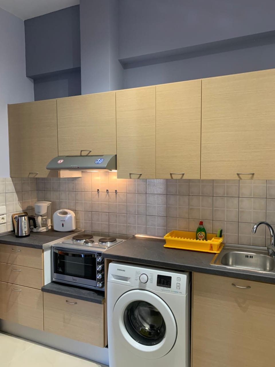Coffee/tea facilities, Kitchen or kitchenette, stove, toaster, washing machine