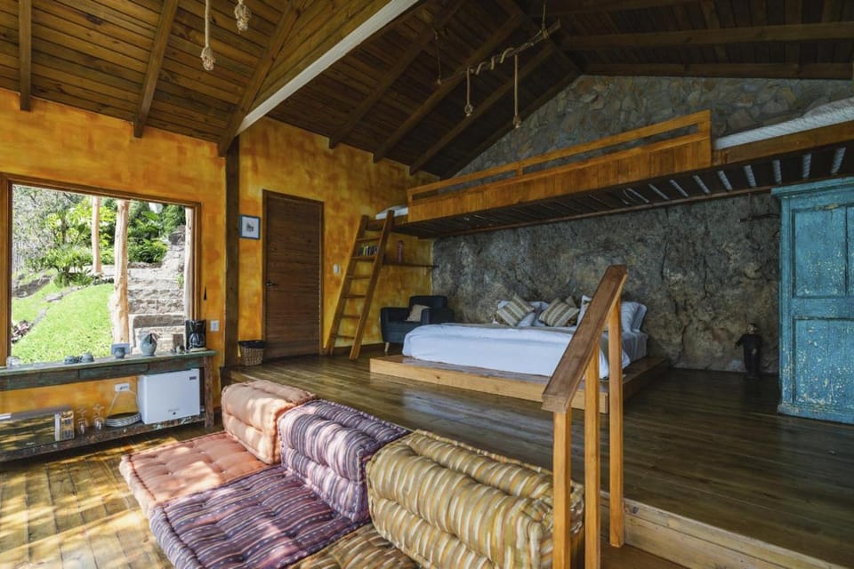 Bed, Living room, Seating area, Bedroom