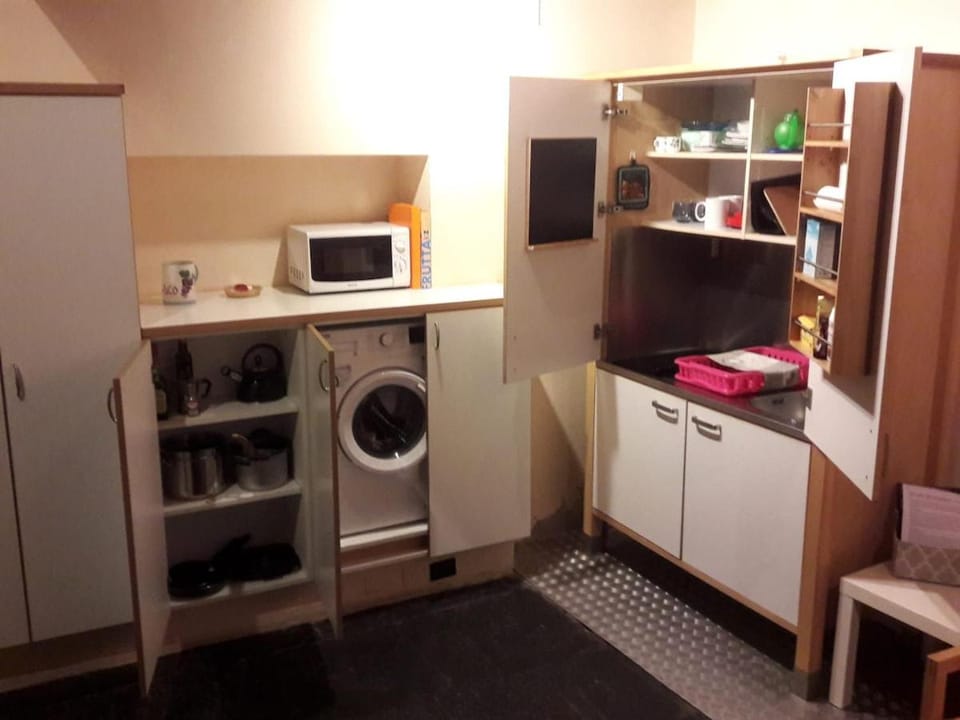 Kitchen or kitchenette, stove, washing machine