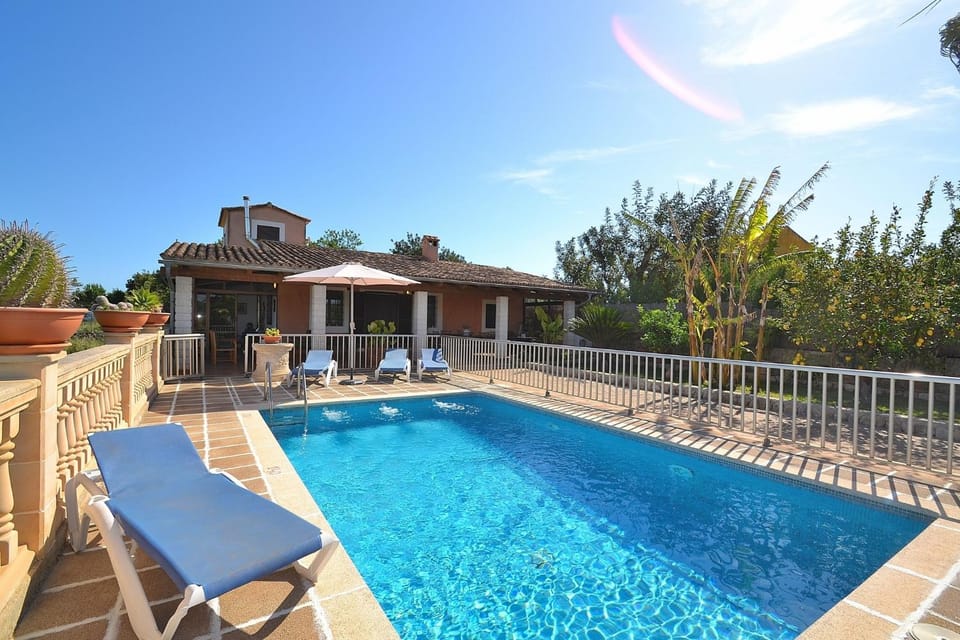 Property building, Patio, Day, Natural landscape, Pool view, Swimming pool, sunbed
