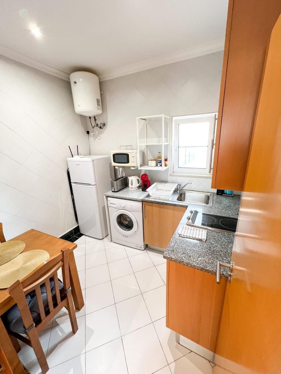 Kitchen or kitchenette, Dining area, oven, stove, toaster, washing machine