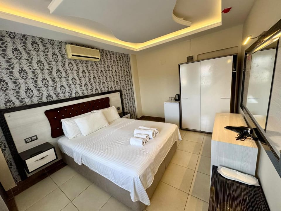 Bed, Bedroom, towels, wardrobe, air conditioner