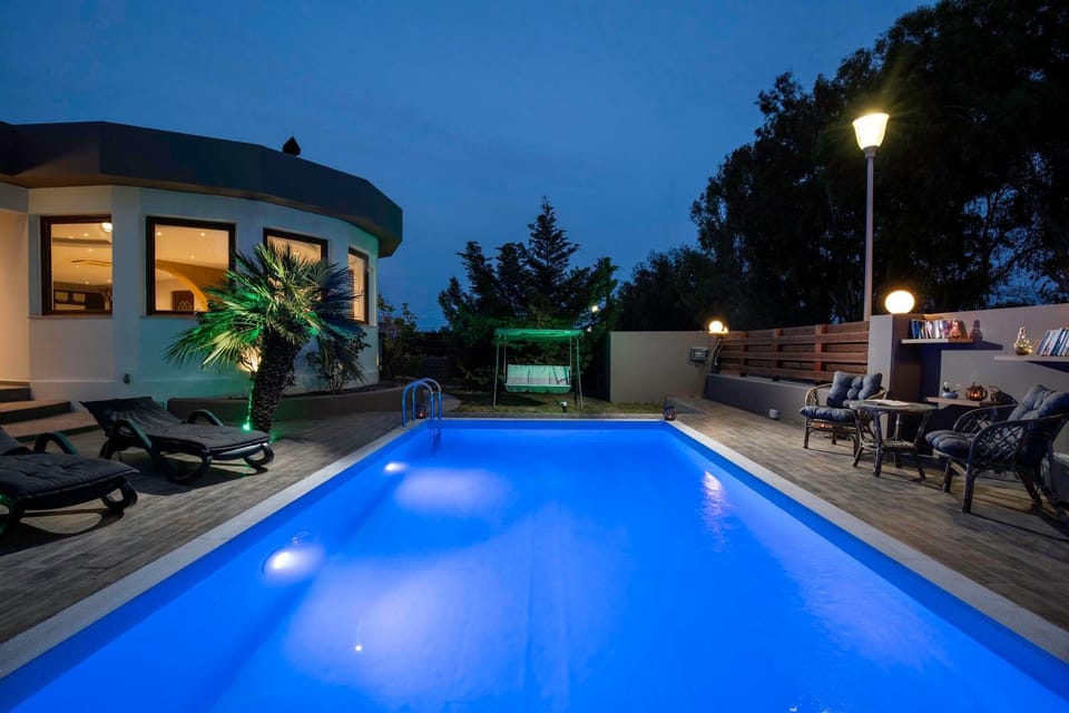 Property building, Night, Seating area, Swimming pool, sunbed