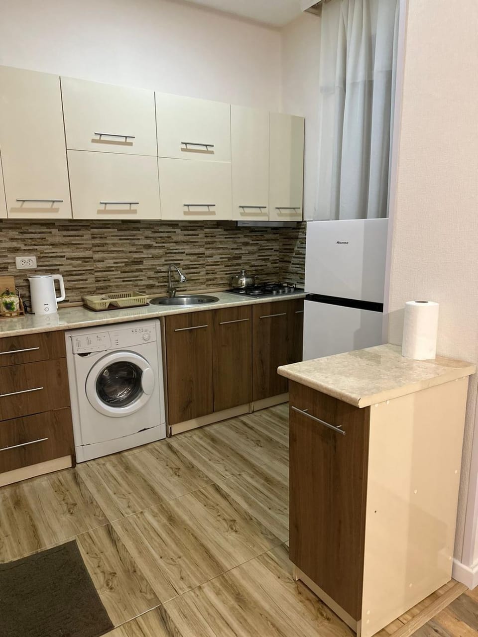 Kitchen or kitchenette, dishwasher, stove, washing machine