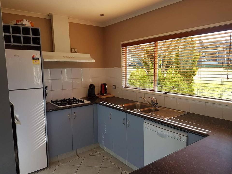 Kitchen or kitchenette, dishwasher, oven, stove