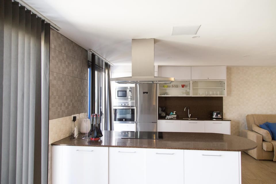 Kitchen or kitchenette, microwave, oven, stove