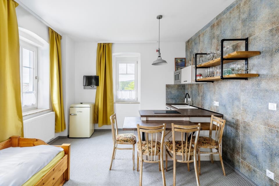 Bed, Kitchen or kitchenette, Seating area