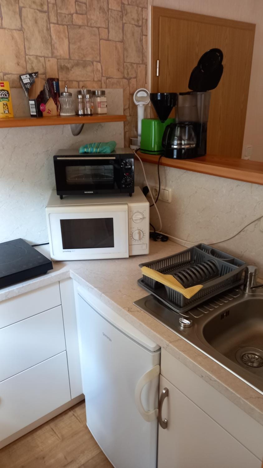 Kitchen or kitchenette, stove, toaster