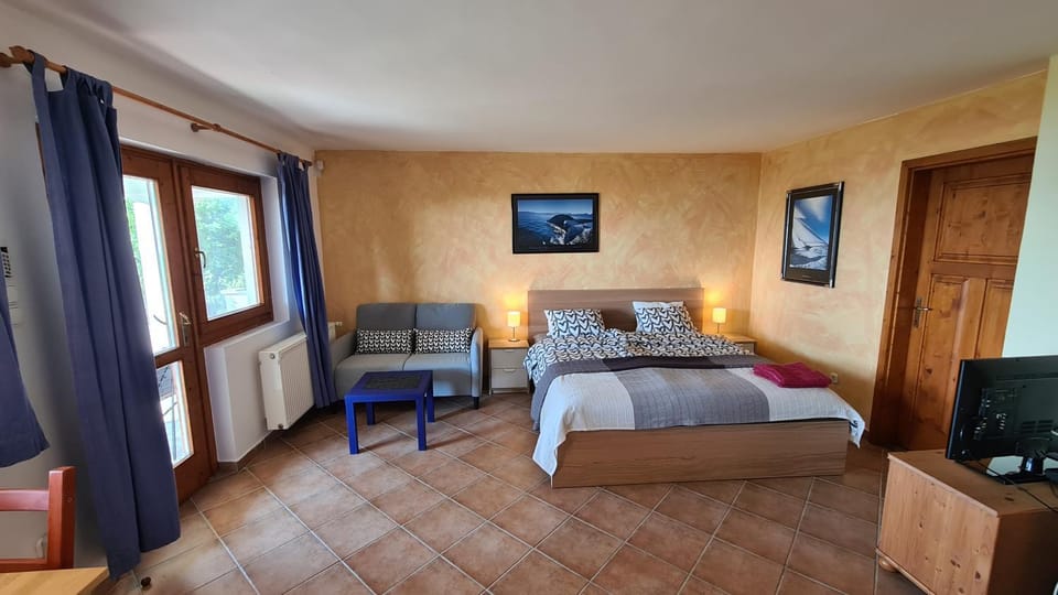 Bed, Living room, Seating area, Bedroom