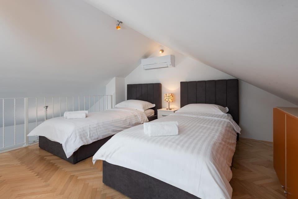 APARTMENTS BRUNO 1&2 - two-room penthouse apartments - wonderful panoramic view of the sea - the best location, first row to the beach - 10 minutes from Supetar ferry port - free secured parking - facilities nearby Apartment in Split-Dalmatia County