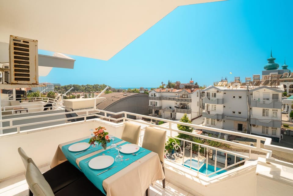 Property building, Day, View (from property/room), Balcony/Terrace, Living room, Seating area, Dining area, City view, Pool view
