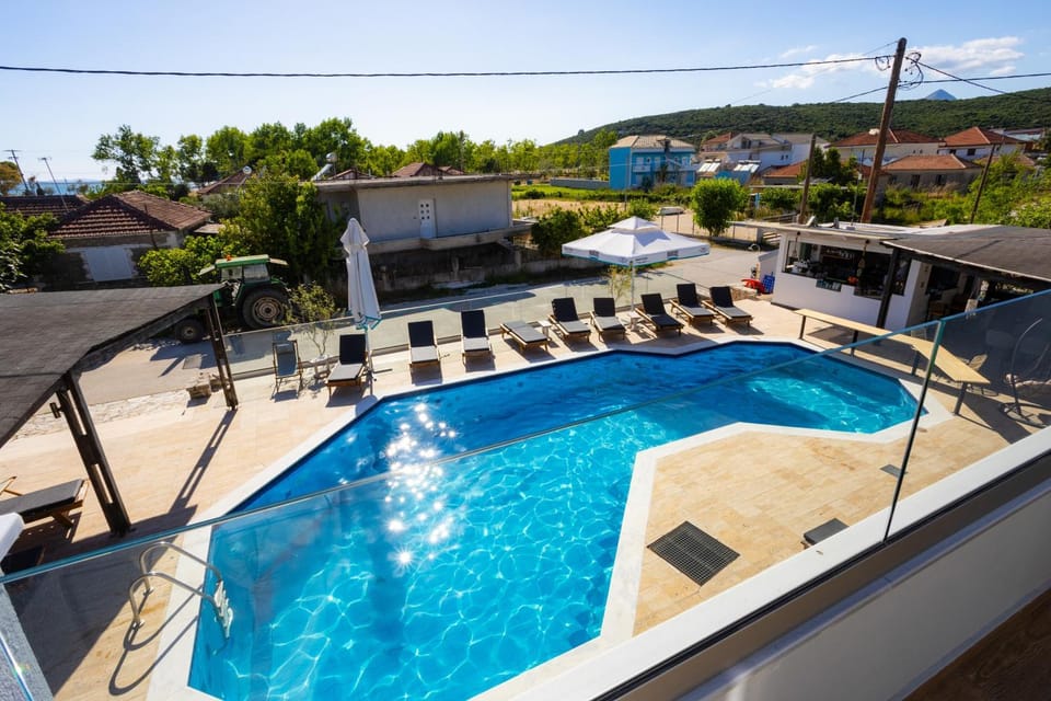 Property building, Patio, Day, Pool view, Swimming pool