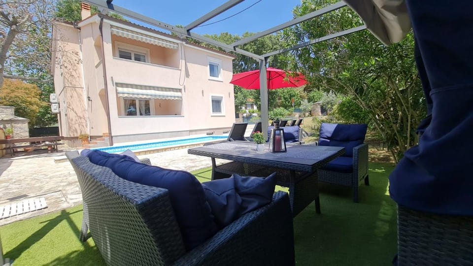 Patio, Seating area, Pool view, Swimming pool, sunbed