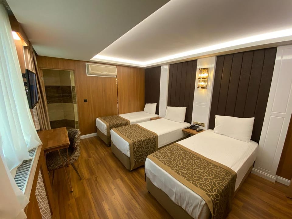 Bed, TV and multimedia, Photo of the whole room, Bedroom, City view, Breakfast, Drinks, Family, internet, room service, room service, safe, wardrobe, air conditioner