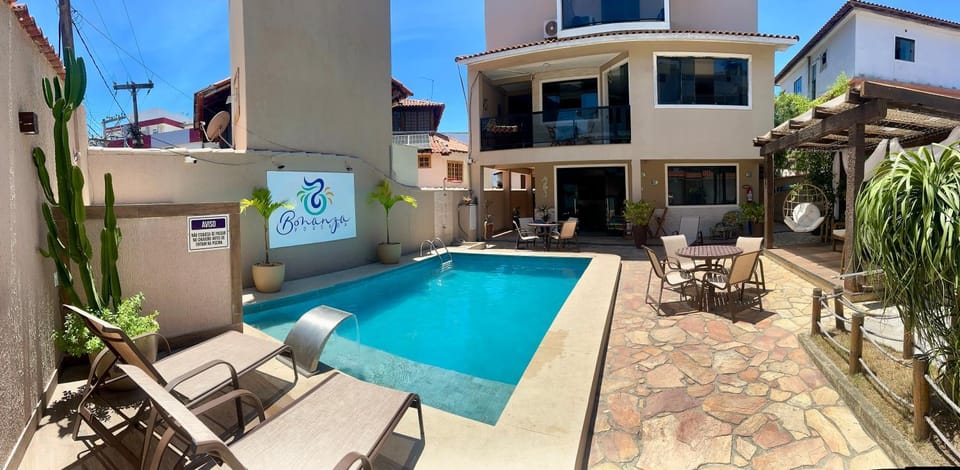 Property building, Patio, Day, Pool view, Swimming pool, sunbed